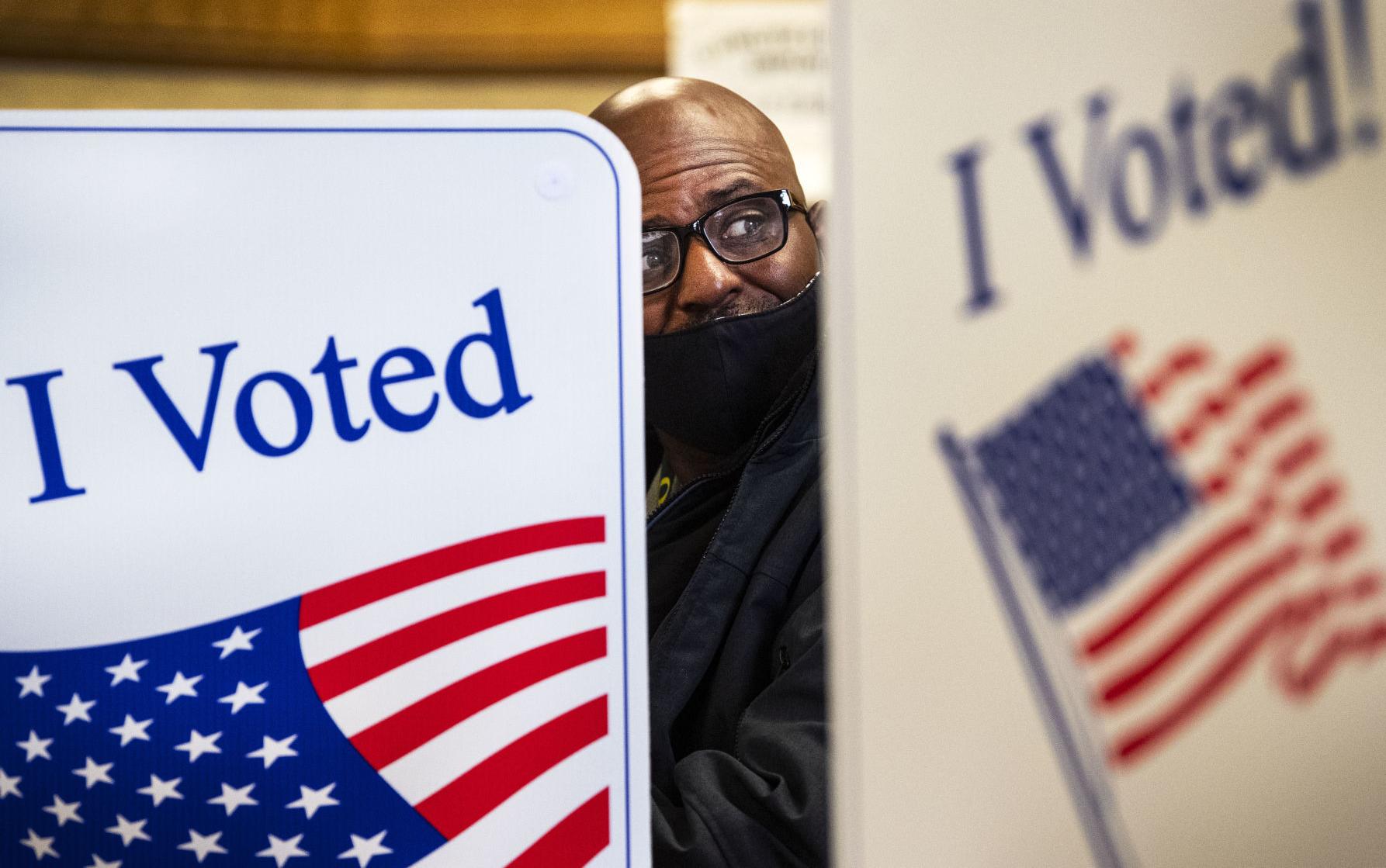 Voters cast ballots in person on Election Day